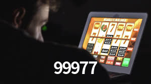 99977